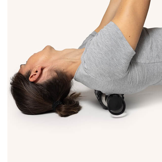 Vattenflaska och foamroller i ett